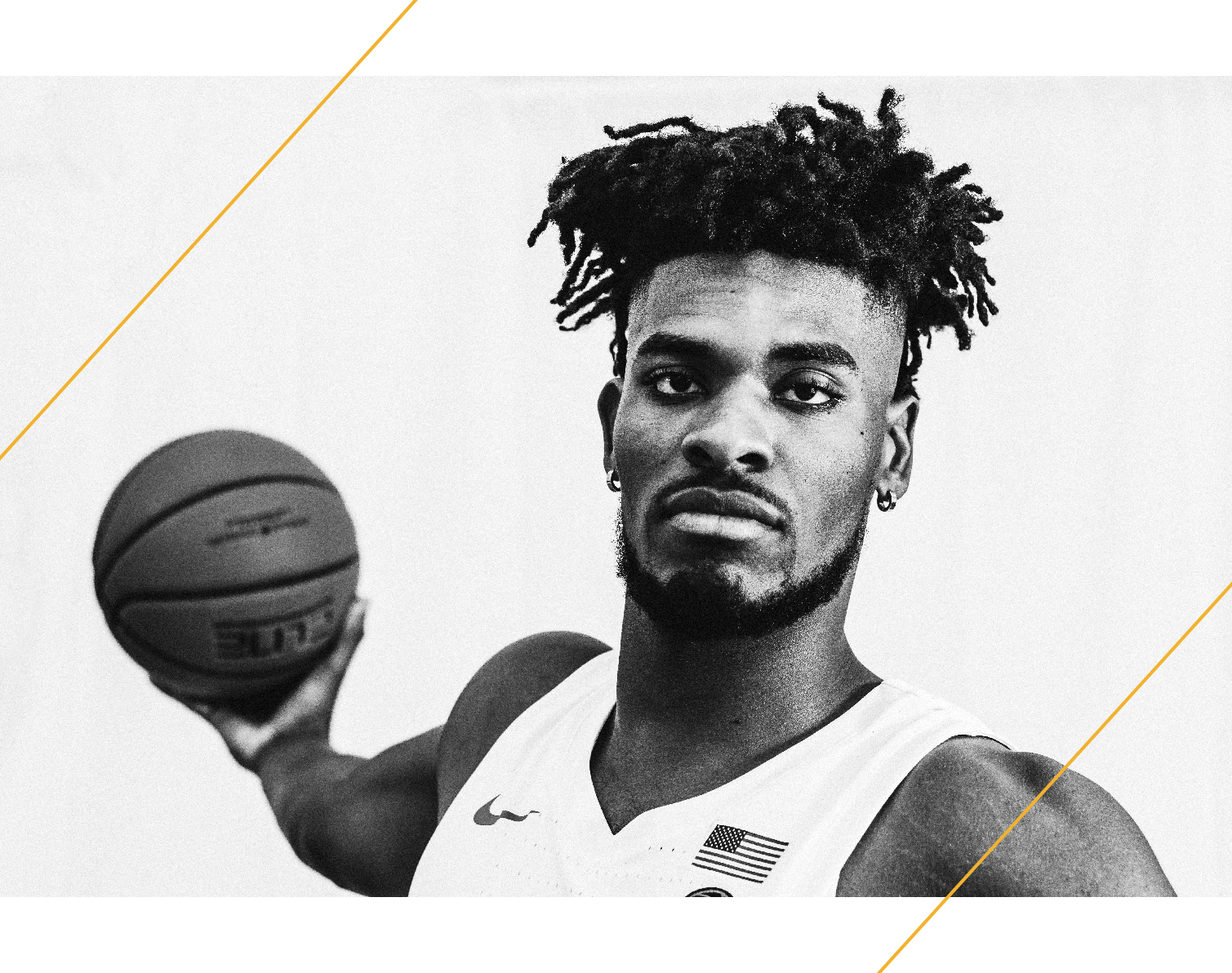 Quincy Guerrier holding a basketball