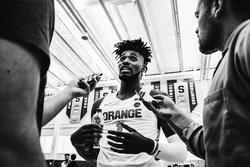 Quincy Guerrier talking to reporters